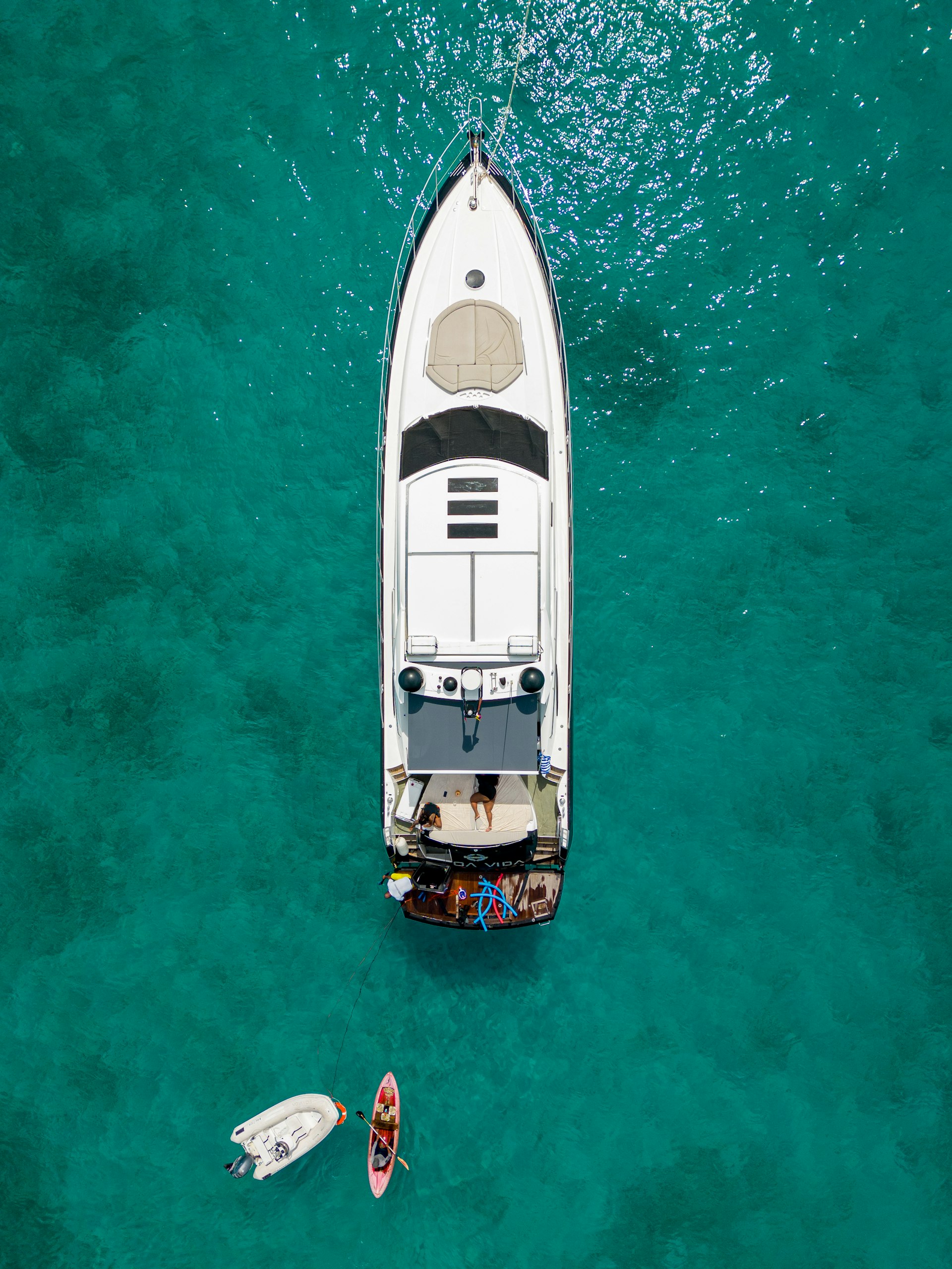 Aerial view of a luxury yacht on turquoise water