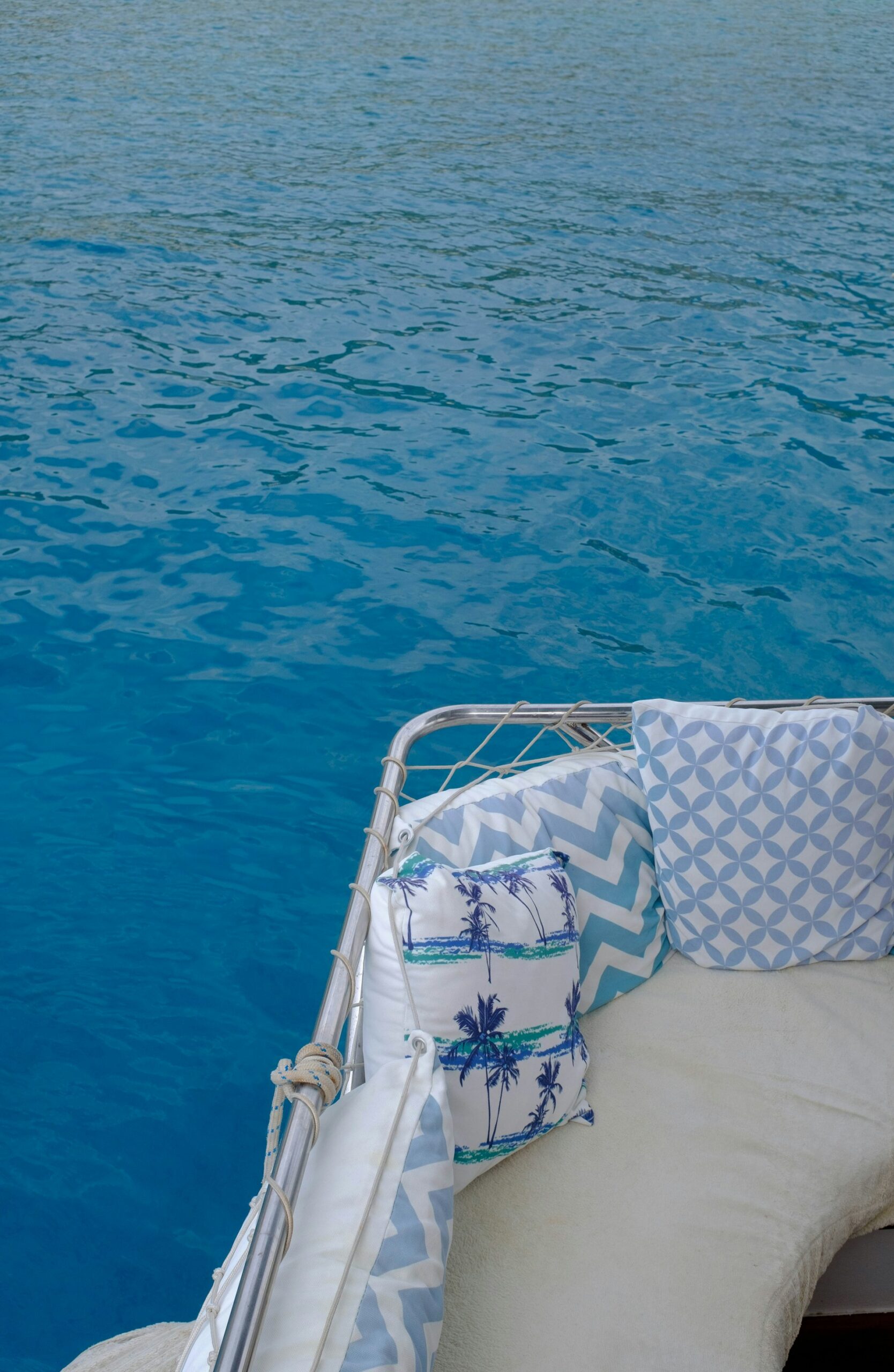 Cushioned yacht deck overlooking bright blue water